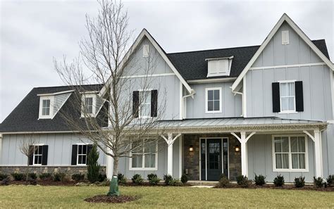 grey house white metal roof|black roof with gray siding.